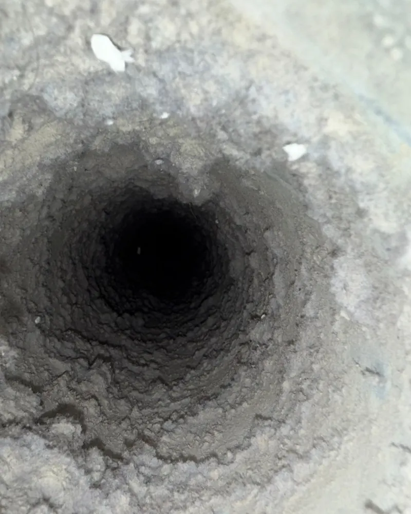 Clogged dryer vent before cleaning at a Boca Raton, FL home.